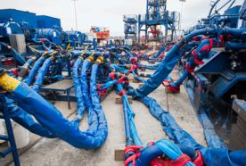 Blue pipes at a plant used for fracking