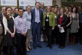 Daniel Poulter MP standing with research staff at the Centre