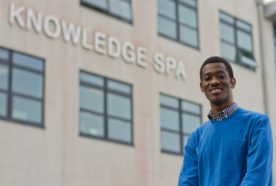 Ghanaian student Gameli Adzaho standing in front of the Knowledge Spa