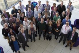 The HPRU group of researchers all pose for a photo, taken from above