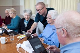 Older people explore smart home technology on portable tablets