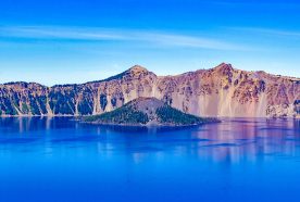 A panoramic view of a lake and mountains